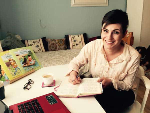 Emma Jane Leeson Author of Johnny Magory | Irish American Mom A person sitting at a table with a book and pen