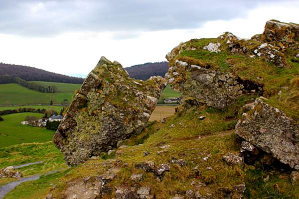 Broken walls in the castle of Dunamase | Irish American Mom A fallen castle wall covered in moss and grass
