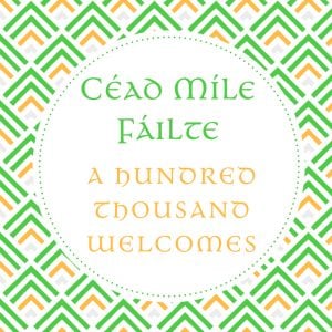 A green and orange graphic saying a hundred thousand welcomes in the Irish language