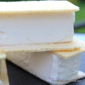 A slice of vanilla ice cream sandwiched between two wafers
