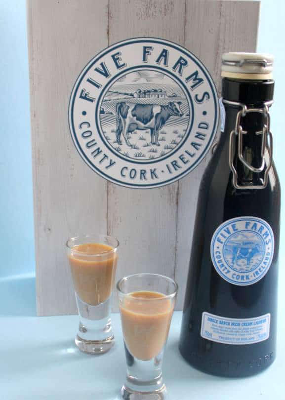 Five Farms Irish Cream with presentation gift box - a perfect gift from Ireland. | Irish American Mom A bottle and a glass of Irish cream on a table