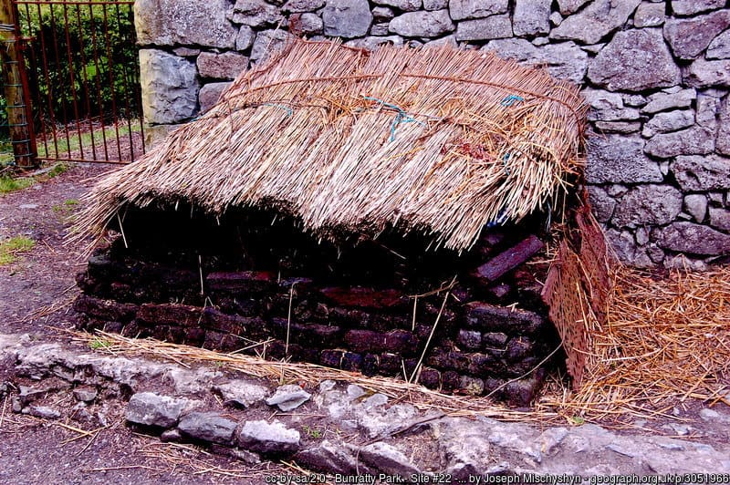 Sheafs of straw covering a stack of turf or peat