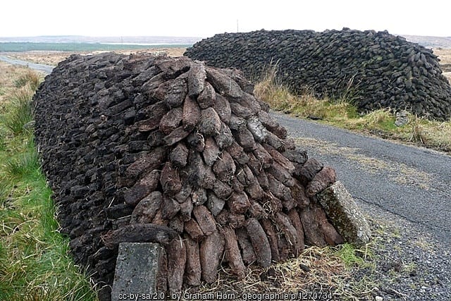 A close up of a stack of turf or peat