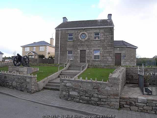An old stone building with a clock