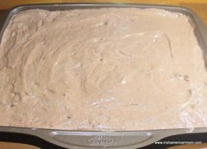 Chocolate cake batter in a baking pan