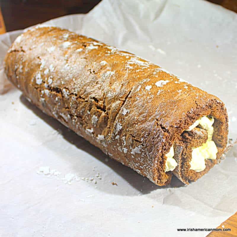 A chocolate cake roll with fresh cream filling