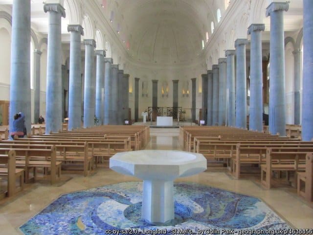 A holy water or baptismal fond in the nave of a church