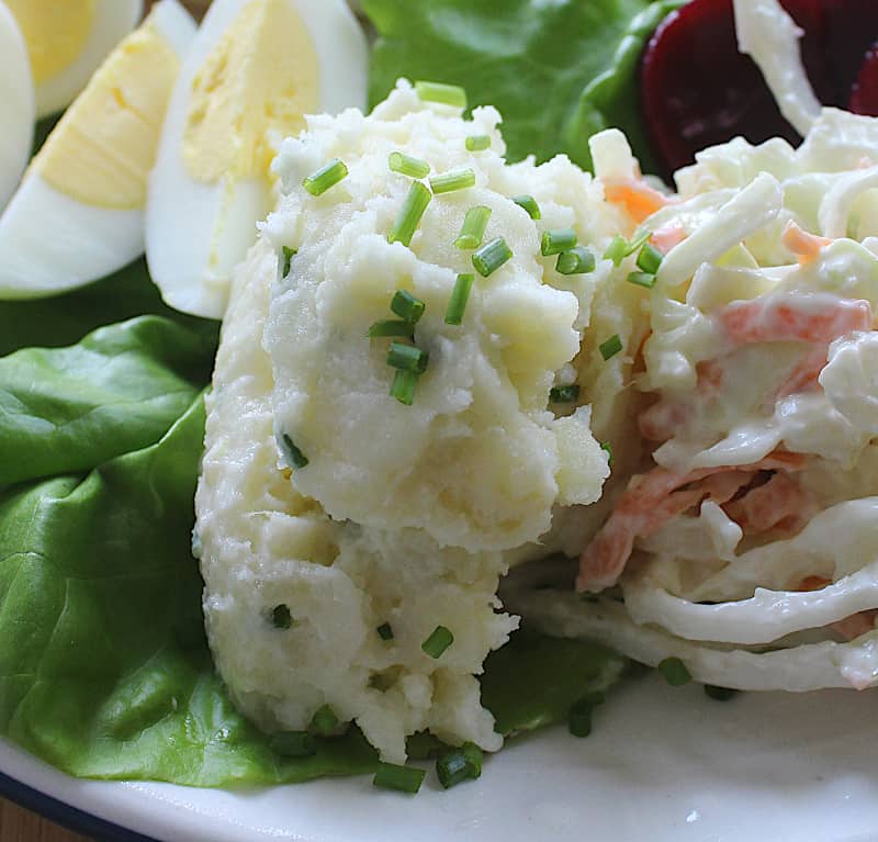 A spoonful of mashed potato salad on an Irish pub style salad | Irish American Mom Mashed potato salad on an Irish salad or pub salad.