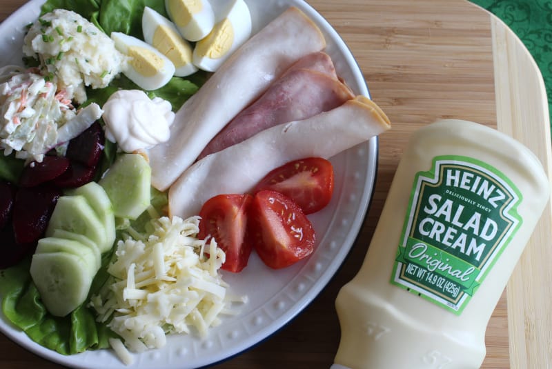 An Irish salad beside a bottle of salad cream | Irish American Mom A plate of food on a table, with Salad and Ham