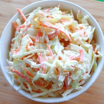 Looking down on a bowl of Irish creamy coleslaw with carrot and cabbage shreds