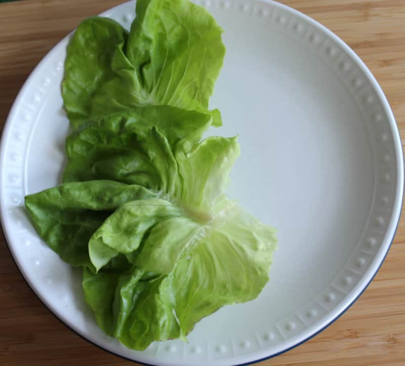 Lettuce leaves on a plate for building an Irish salad | Irish American Mom Salad or lettuce on a plate