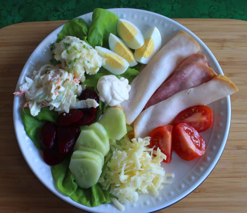 Vegetables and mixed salads on an Irish salad plate | Irish American Mom Lettuce, eggs, meat, tomato, cheese, cucumber, beetroot,coleslaw and potato salad with mayonnaise on an Irish salad plate.