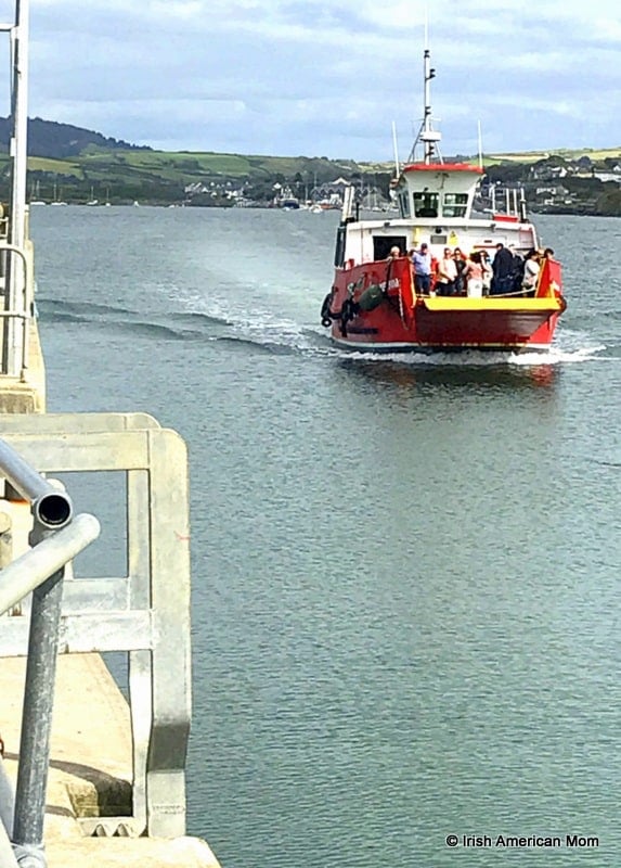 Sherkin Island ferry approaching the pier on the island | Irish American Mom A small boat in a body of water