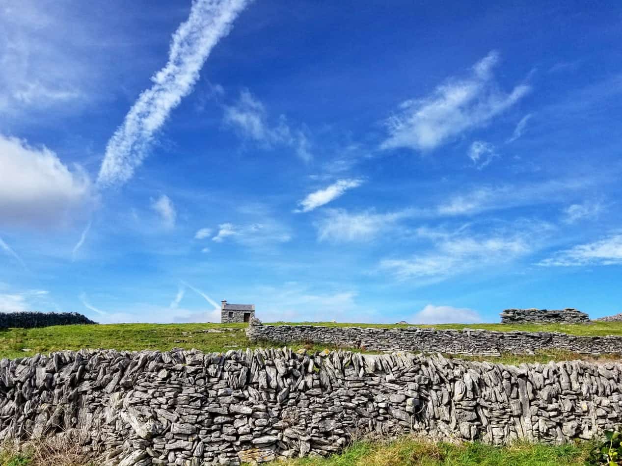 A small stone house and stone walls of rural Ireland