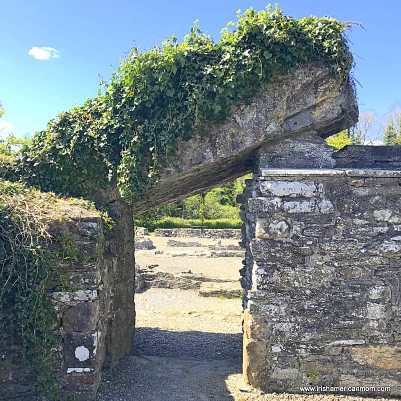 A collapsed wall over a doorway at Old Mellifont Abbey | Irish American Mom A fallen slab over an old church wall forming a portal at an Irish monastic site