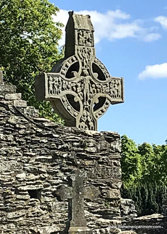 Stone cross and ruined church