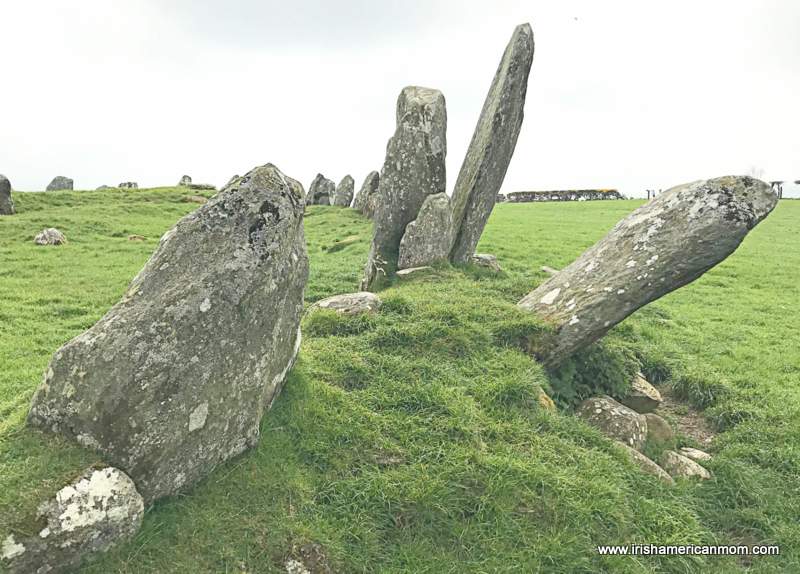Smaller standing stones leaning at an angle at the Beltany Stone Circle | Irish American Mom Section of a stone circle with some of the standing stones at a tilt