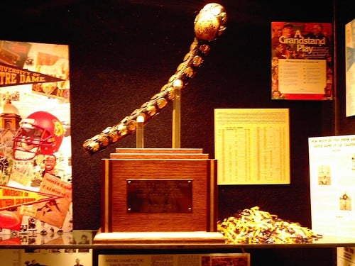 The Jewelled Shillelagh a strange football trophy for the USC vs Notre Dame annual game | Irish American Mom Trophy cabinet showing the Jewelled Shillelagh trophy of Notre Dame