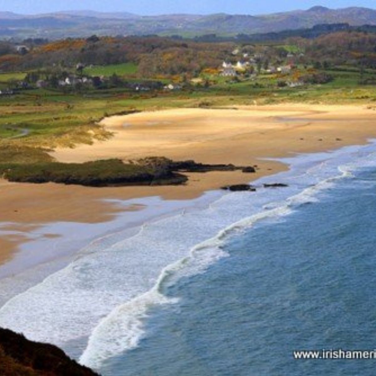 Waves and sea foam on the shore of Knockalla beach in County Donegal