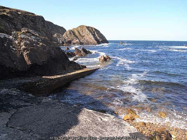 Slipway into the ocean with rocky shoreline