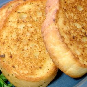 Slices of Texas toast on a blue plate