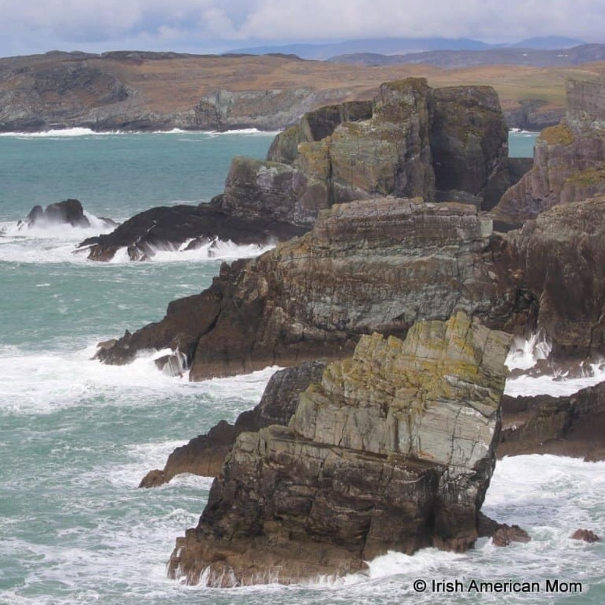 The cliffs and rock formations at Mizen Head in County Cork | Irish American Mom Three large rock formations jutting into the ocean in Ireland
