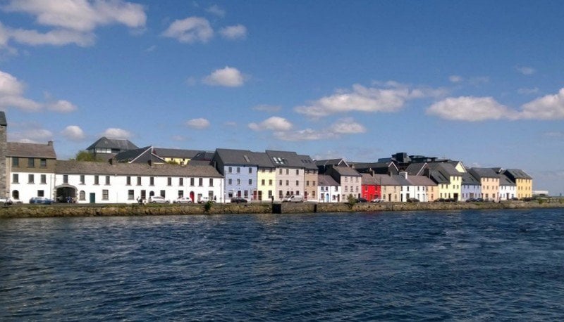 Long Walk in Galway Ireland by Day | Irish American Mom A row of colorful homes beside a quay and blue ocean