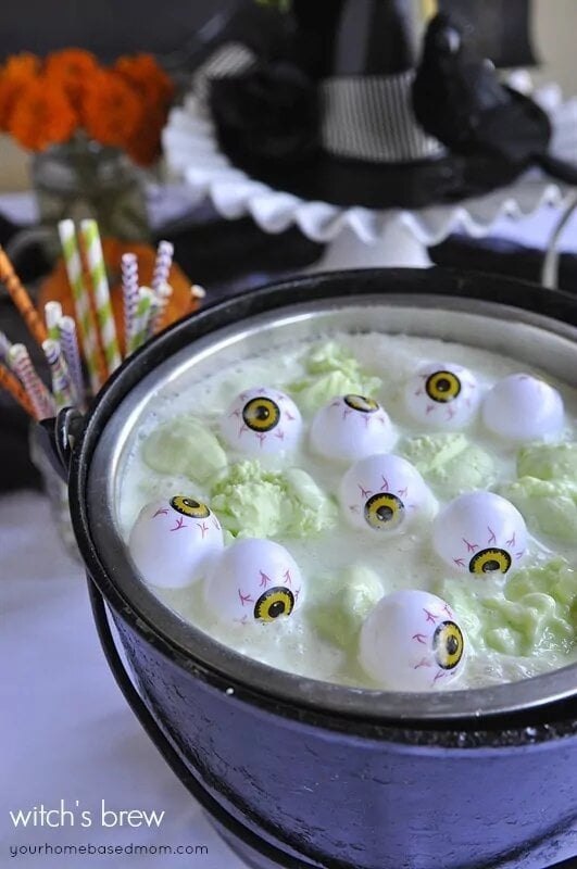 A cauldron of green witch's brew with bubbling eyeballs for Halloween