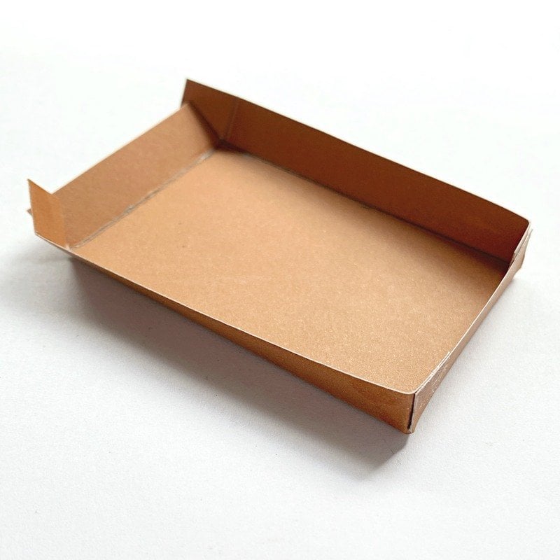 A brown cardboard base for a paper Christmas tree craft | Irish American Mom Brown card rectangular box