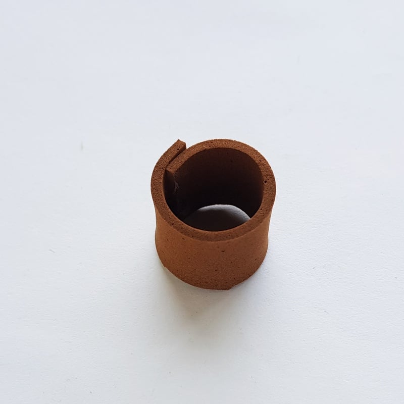 Brown craft foam used to create a circular tree trunk | Irish American Mom A brown cone created from craft foam to look like a tree trunk