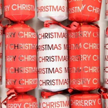 Red and white Christmas crackers with text