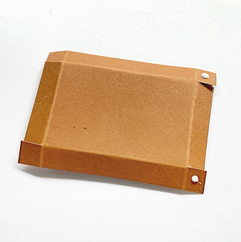 Natural | Irish American Mom Brown card paper cut out with edges folded and glue on the tips