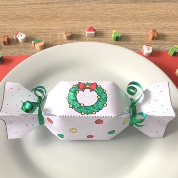 Paper Christmas cracker on a white plate
