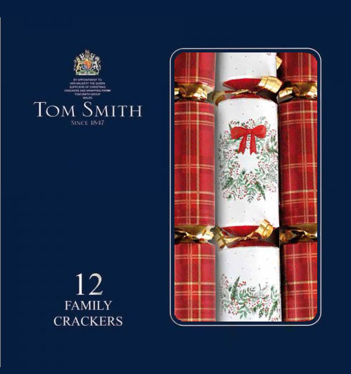 Tartan crackers beside a white cracker with holly and a red bow in a navy box with text