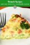 Close-up of a slice of ham and broccoli crustless quiche highlighting layers of eggs, vegetables, and melted cheese.