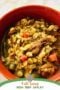 Bowl of beef barley soup with text banner