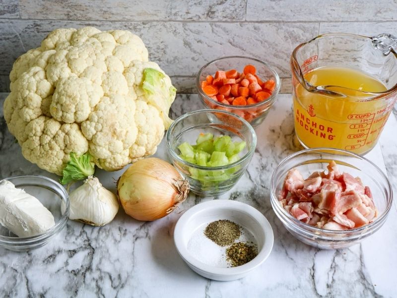 Cauliflower, onion, garlic, cream cheese, carrots, celery bacon, salt, pepper and stock