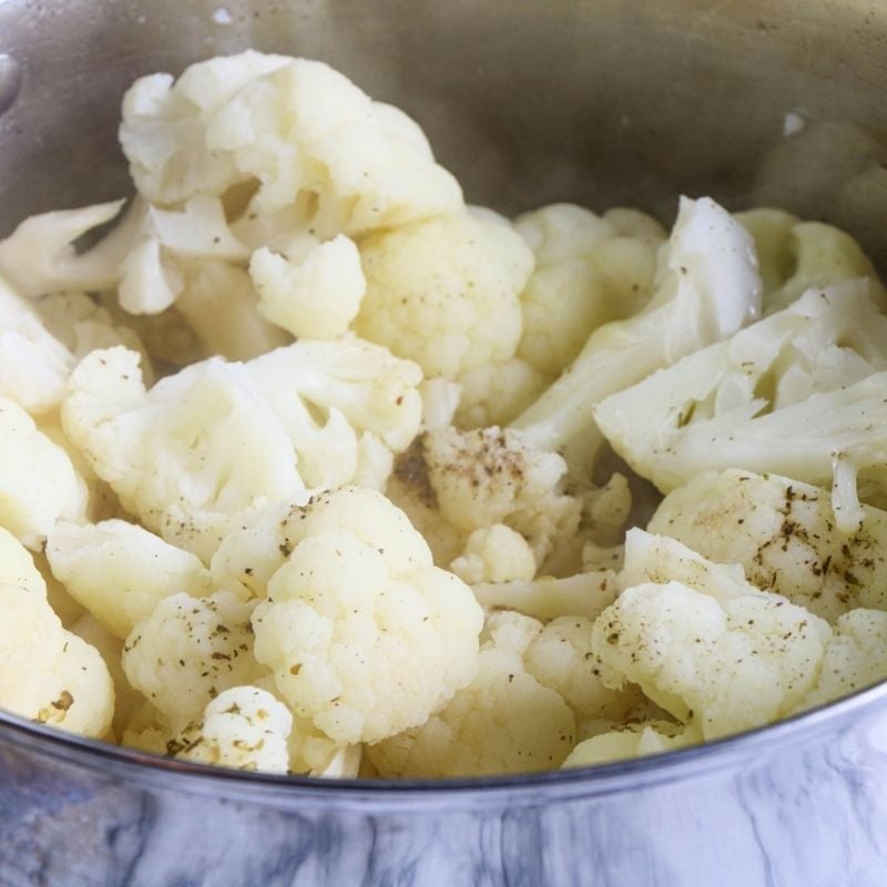 Cauliflower florets in a soup pot