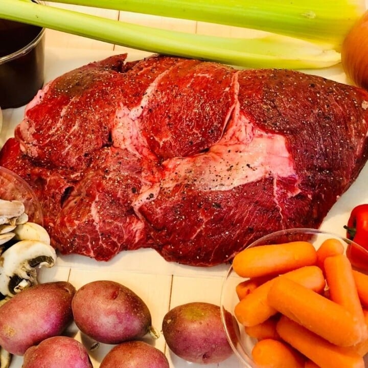 Shoulder or chuck roast seasoned with salt and pepper | Irish American Mom A joint of chuck roast seasoned with salt and pepper and surrounded by vegetables