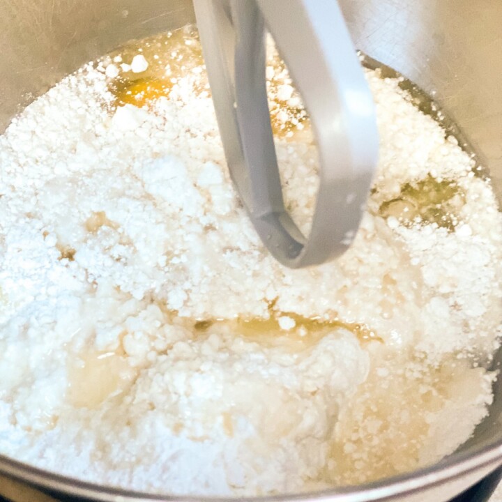 Mixing cake mix in an electric mixer | Irish American Mom Cake mix, oil and eggs in the bowl of an electric mixer