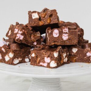 Slices of chocolate marshmallow and caramel cake slices on a cake stand