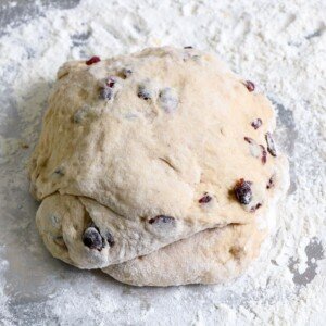 Hot cross bun dough turned out onto a floured surface