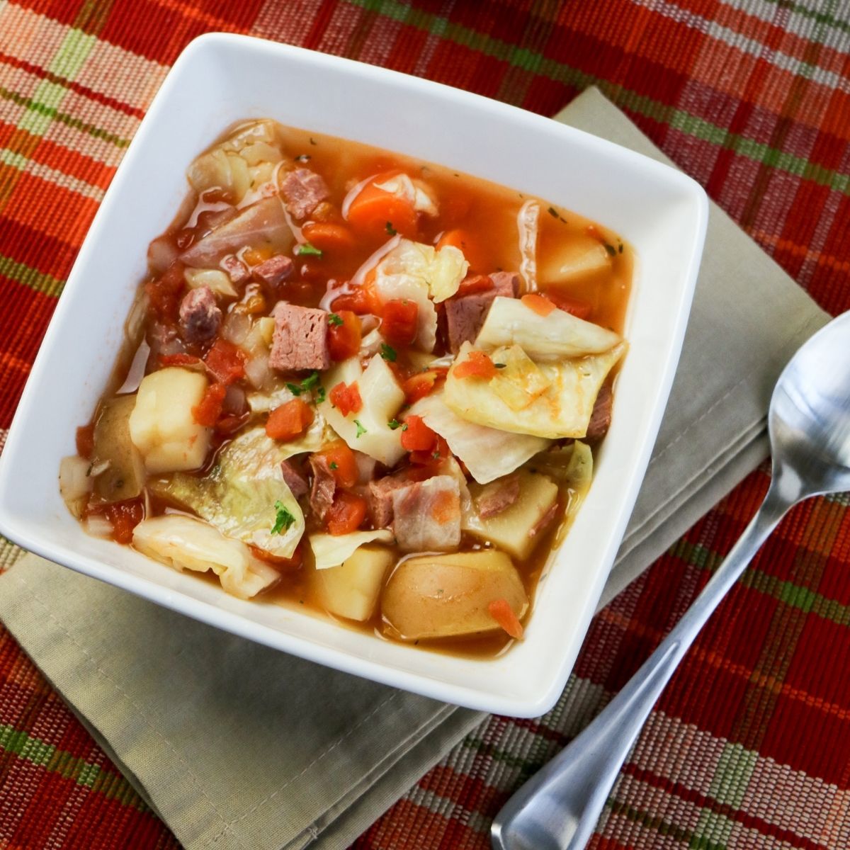 Cabbage and corned beef soup served in a bowl Featured image | Irish American Mom Bowl of corned beef and cabbage soup