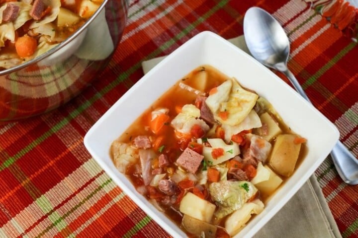 Leftover corned beef and cabbage soup in a bowl | Irish American Mom A square bowl of hearty corned beef and vegetable soup