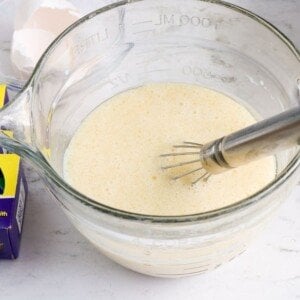 Eggs milk oil and vanilla in a bowl
