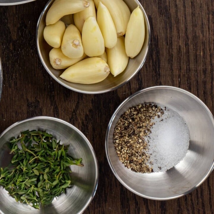 Fresh thyme garlic cloves and salt and pepper for stuffed mushrooms | Irish American Mom Garlic cloves, fresh thyme and salt and pepper in bowls