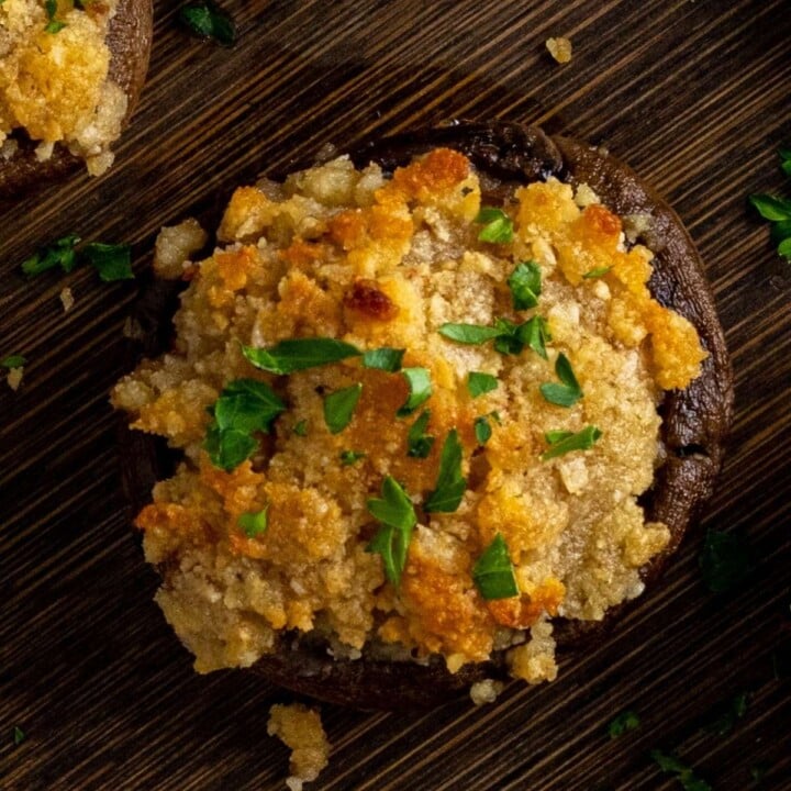 Irish cheddar cheese stuffed mushroom with garlic and breadcrumbs | Irish American Mom Close up view of a stuffed mushroom