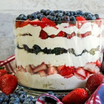 Cream and fruit layered trifle in a glass bowl