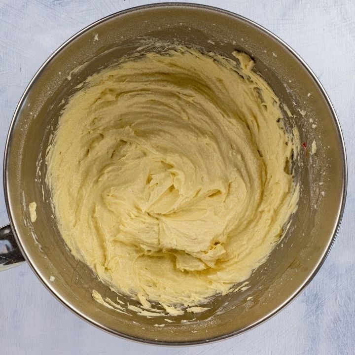 Flour added to batter for Irish Cherry tea cake | Irish American Mom Cake batter in a mixing bowl