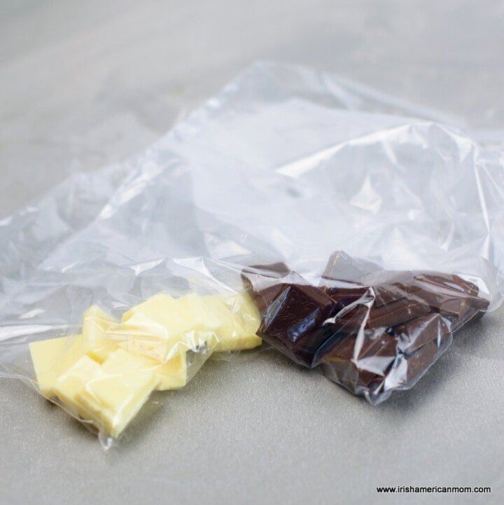 Melting chocolate in piping bags for making candy spider webs for Halloween | Irish American Mom Melted chocolate in piping bags